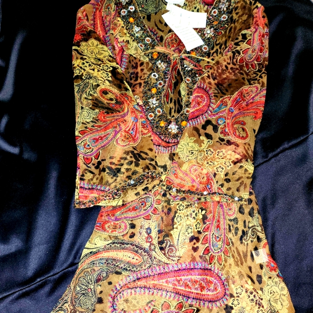 Solitaire Woman's top or dress tag says size large.